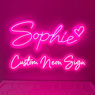 Customized pink LED neon sign saying 'Sophie' with heart, perfect for kids' bedrooms and personalized decor.